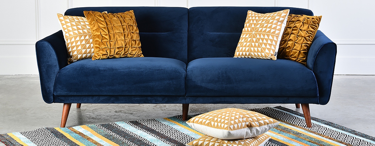 Blue two-seater sofa with cushions