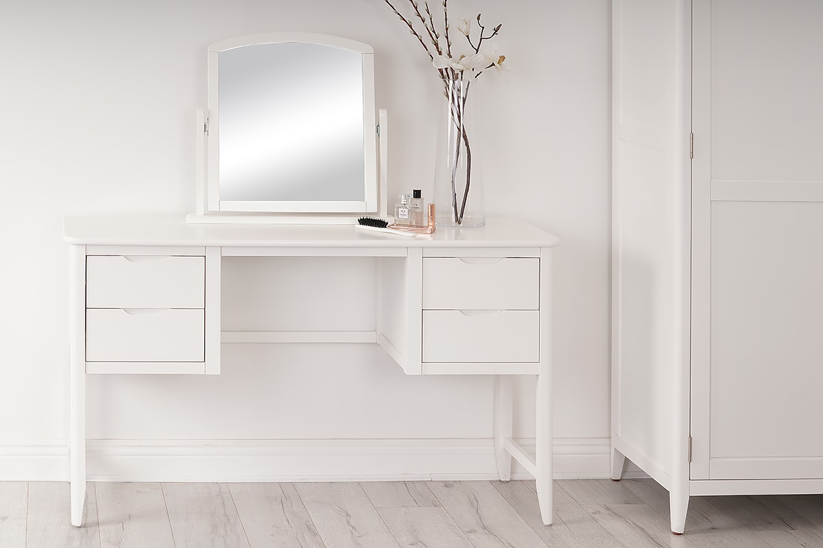 Simple dressing table, mirror and wardrobe ensure that the chosen aesthetic can remain minimalist