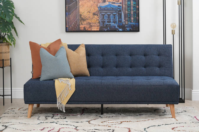 Image showcasing the versatile design of Studio Navy Fabric 3 Seater Sofa Bed